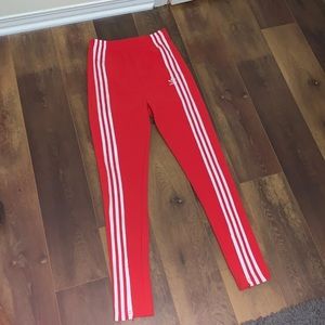 Red Adidas track pants